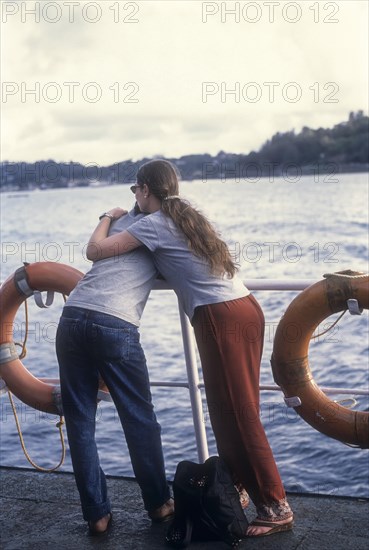 Couple standing on ship together