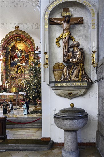 Baptismal font and main altar with Christmas tree