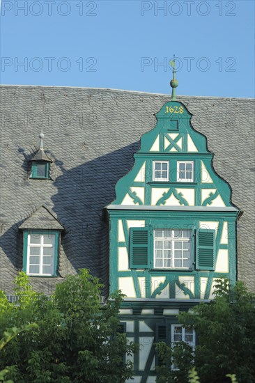 Tail gable with year of the half-timbered house Hotel and Restaurant Schwan built 1628 in Oestrich