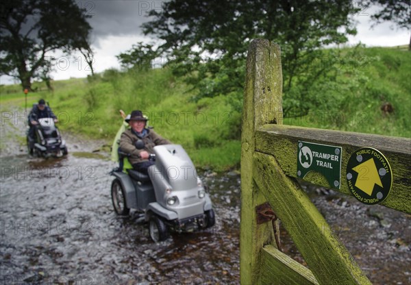 Signs for Tramper Trail and public footpath at gate