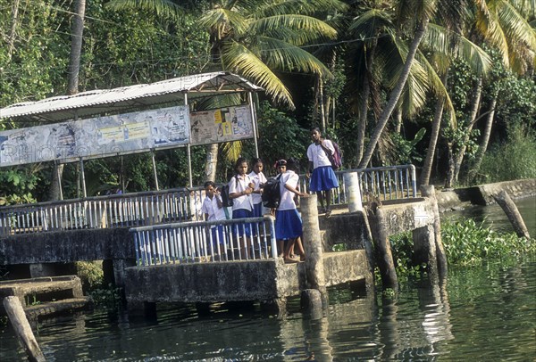 Girls Waiting boat jetty for a passenger boat near Alappuzha