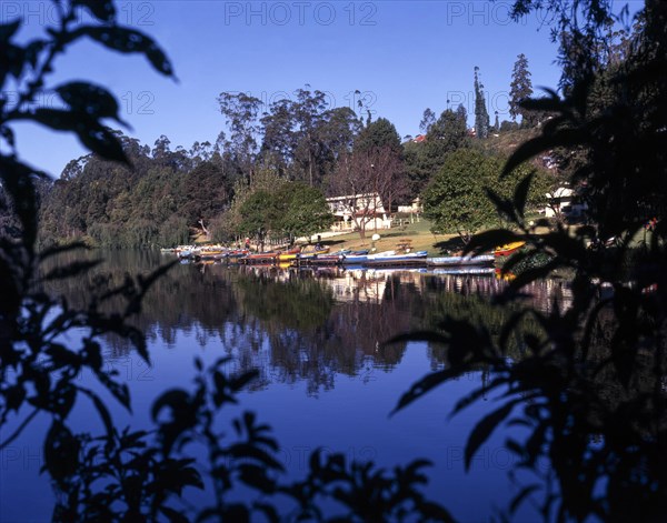 Colourful Boats in front of boat house