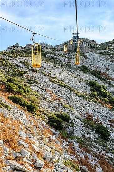 Ropeway Cabinovia Monte Capanne with open gondola Ropeway gondola standing gondola on mountain Monte Capanne