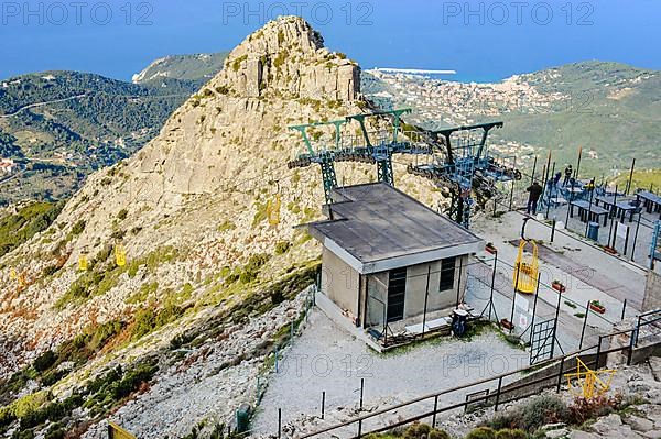 Mountain station of cable car Cabinovia Monte Capanne with open gondola cable car gondola standing gondola on mountain Monte Capanne