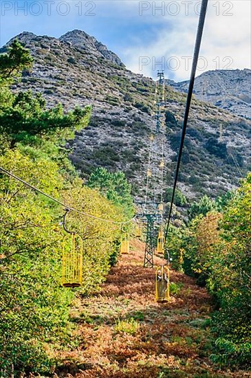 Ropeway Cabinovia Monte Capanne with open gondola Ropeway gondola standing gondola on mountain Monte Capanne