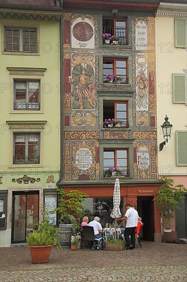 Street pub with mural on Muensterplatz in Bad Saeckingen