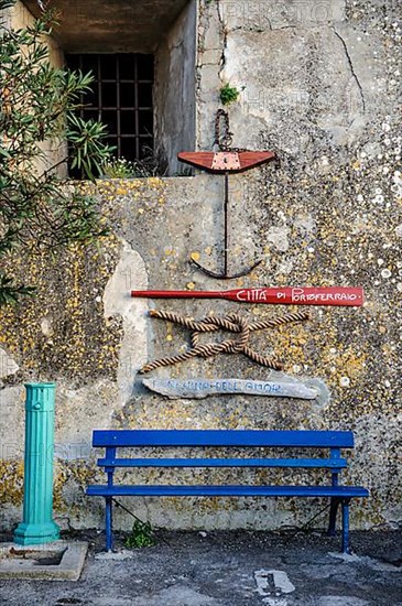 Wall decoration of nautical symbols on old house wall