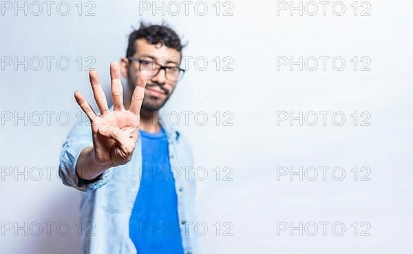 Portrait of people counting number four on isolated background. Person hand counting number four. Handsome guy hand showing number four