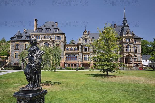 Lieser Castle built in 1885 in historicism with gardens and black sculpture in Lieser