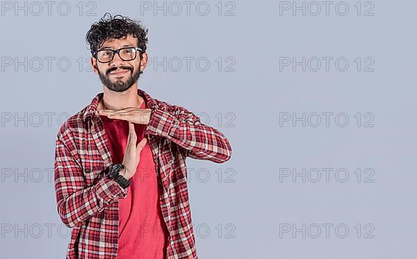 A man gesturing time out