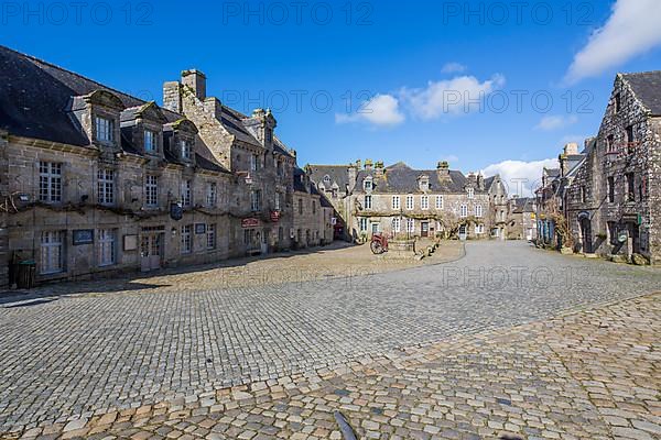 Village square with old horse-drawn cart and fountain