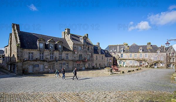 Village square with old horse-drawn cart and fountain