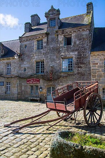 Village square with old horse-drawn cart