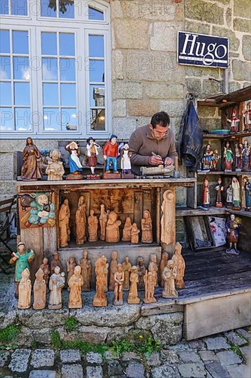 Carvers of Breton figures in the village square