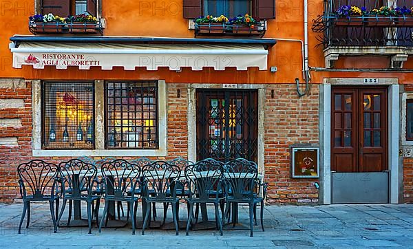 Restaurant with typical Venetian house facade in the lagoon city of Venice