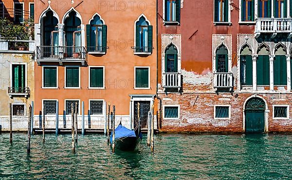 Venetian house facades on the Grand Canal in the lagoon city of Venice