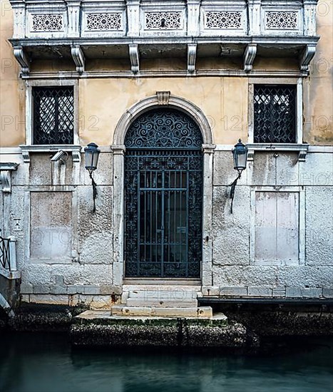 Entrance gate to a residential building on the Grand Canal in the lagoon city of Venice