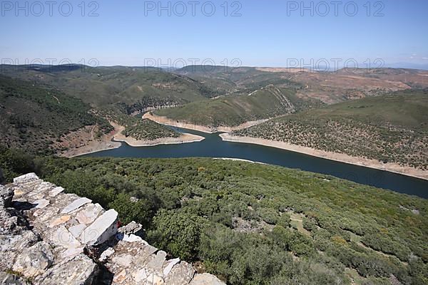 View from Castillo de Monfraguee on landscape with tributary to Rio Tajo in Monfraguee