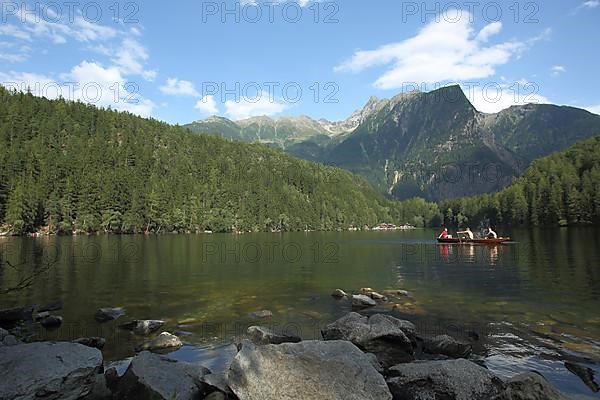 Rowing boat on the Piburg Lake with view of Acherkogel 3007m in Oetz