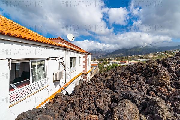 Damaged house in the lava flow