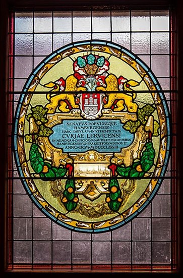 Leaded glass in the town hall shows the coat of arms of Hamburg and insignia of the former Hanseatic League