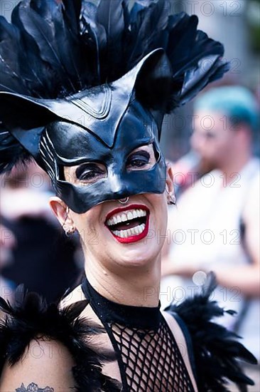 Costumed laughing woman from the SM scene