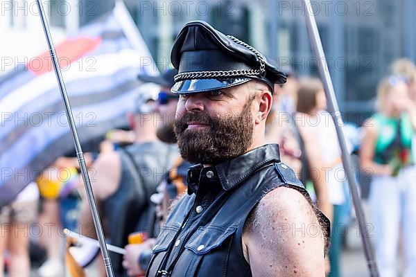 Homosexual men from the SM scene in martial leather clothing at the CSD parade