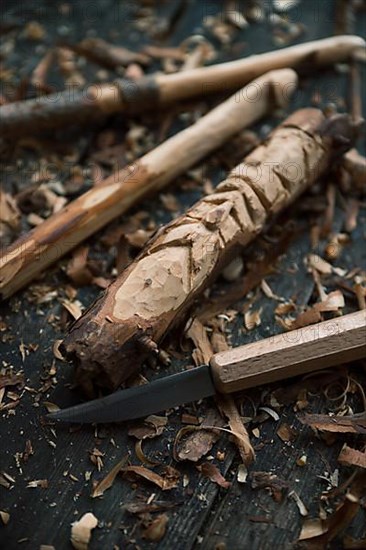 Carved crochet hook and face of an old man