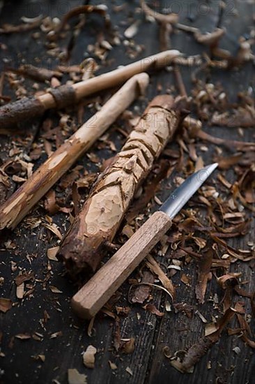 Carved crochet hook and face of an old man