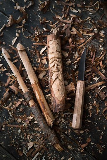 Carved crochet hook and face of an old man