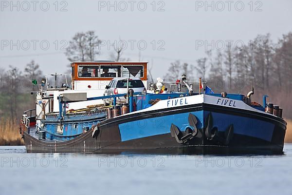 Fully loaded Dutch cargo ship Fivel on the river Peene