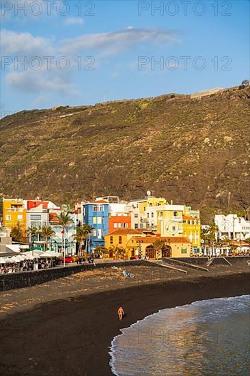 Lava beach and colourful houses in Puerto de Tazacorte