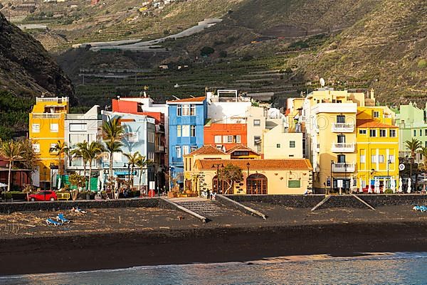 Lava beach and colourful houses in Puerto de Tazacorte