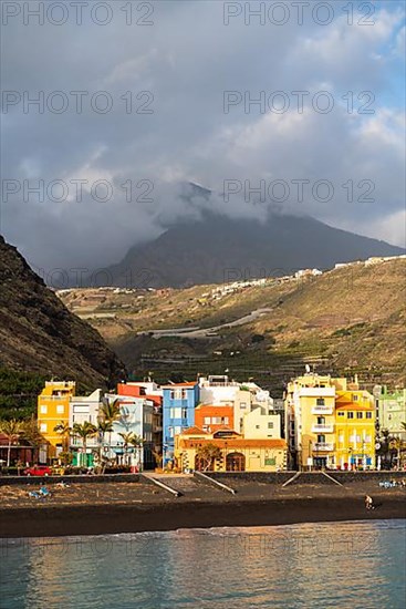 Lava beach and colourful houses in Puerto de Tazacorte