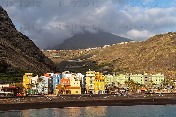 Lava beach and colourful houses in Puerto de Tazacorte