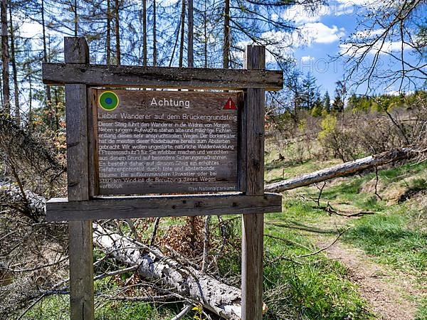 Warning sign at the start of a hiking trail in the Kellerwald-Edersee National Park