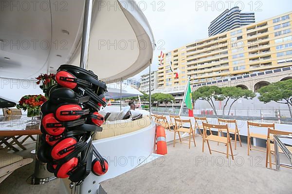 Chairs set up for the spectators on the quarterdeck of a motor yacht at the race track