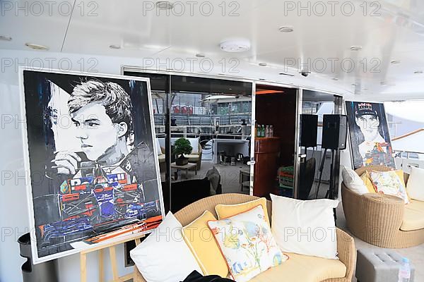 Sofas and paintings with racing drivers and racing cars