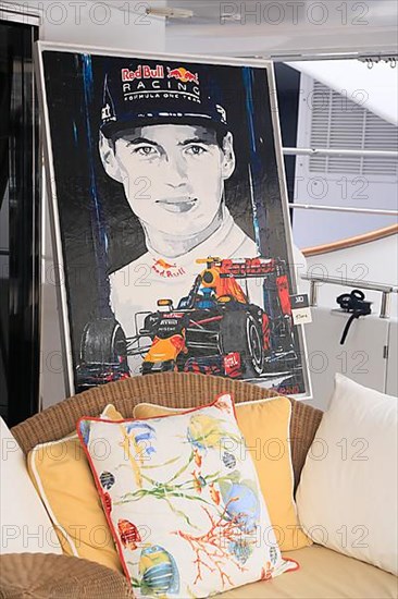 Sofa and painting with racing driver and racing car