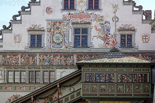 Old town hall in Gothic style with picture friezes and oriel