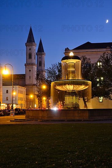 Illuminated fountain of the University and Church of St. Ludwig