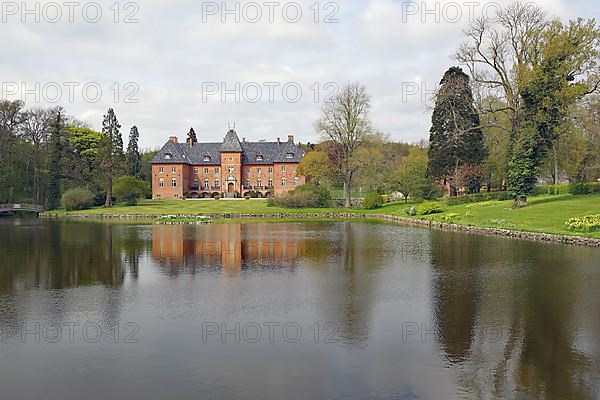 Manor house reflected in a pond