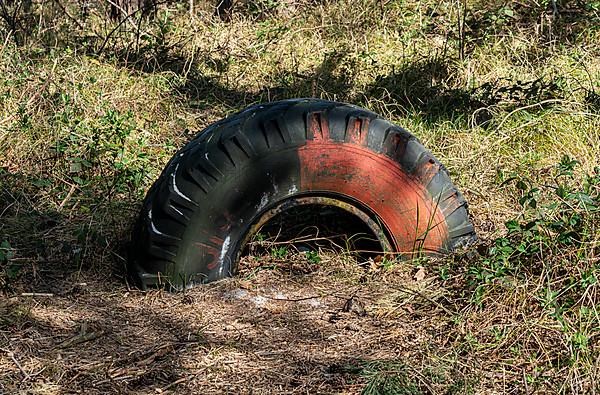 Environmental pollution caused by an old truck tyre