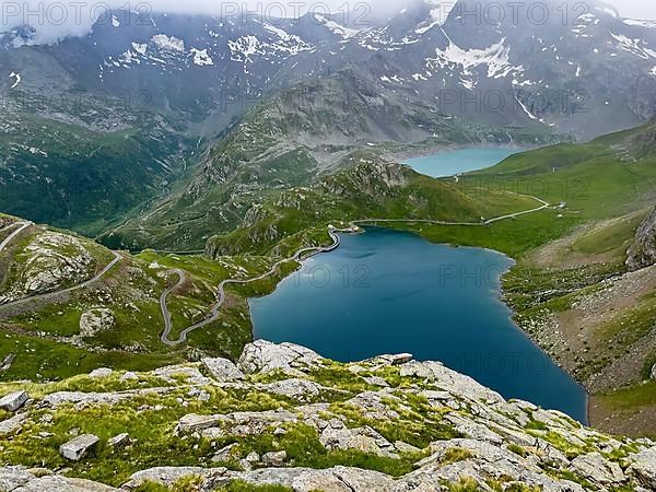 View from panoramic point at Colle del Nivolet on Lago Agnel in front