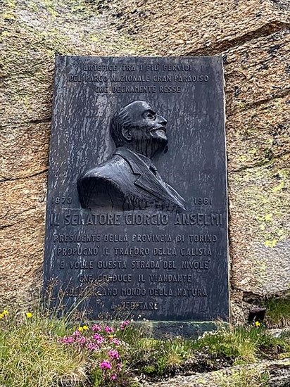 Commemorative plaque on top of Colle del Nivolet pass road in Alps for Senator Giorgio Ermanno Anselmi