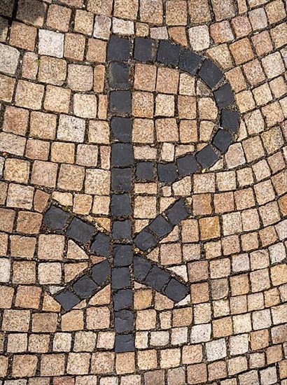 Orthodox cross on the pavement leading to the entrance of Germany's first private ecumenical motorway church Geiselwind Light on our way on the A 3 between Wuerzburg and Nuremberg