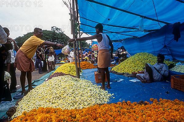A flower market in plotform during Onam festival in Thrissur or Trichur