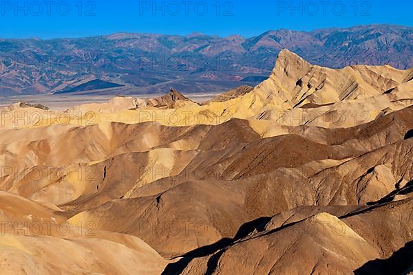 Coloured rock formations in the evening light at Zabriskie Point