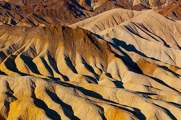 Coloured rock formations in the evening light at Zabriskie Point