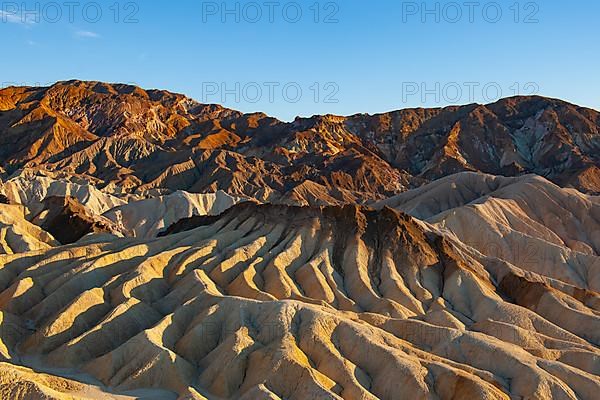 Coloured rock formations in the evening light at Zabriskie Point